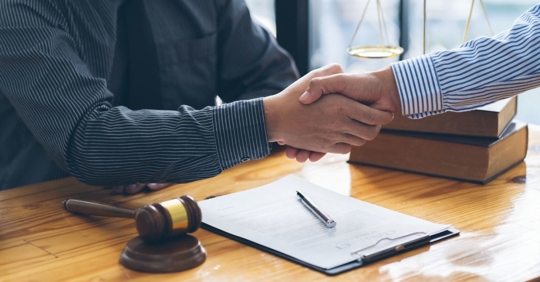 lawyer and client handshake
