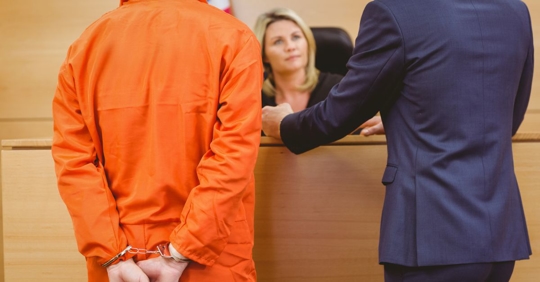 attorney with handcuffed client